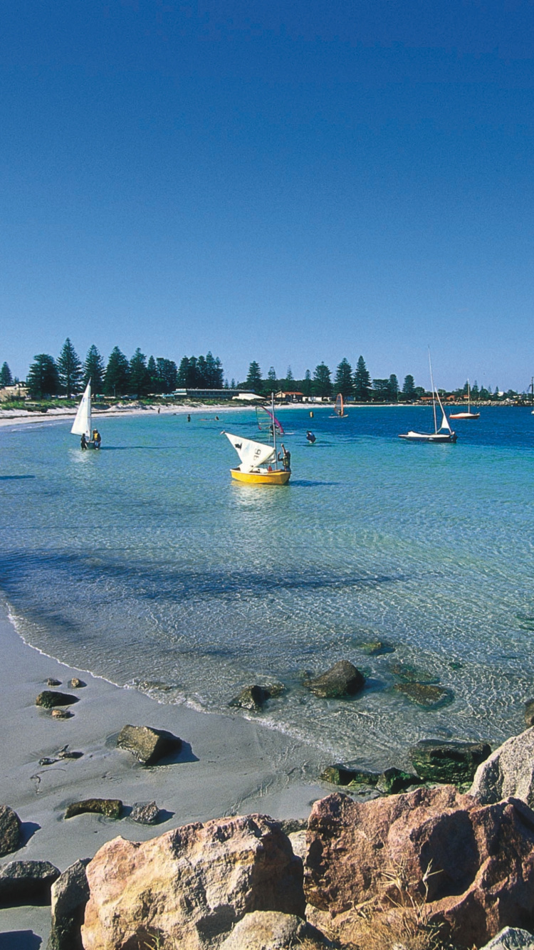 White Sail Boat on Sea Shore During Daytime. Wallpaper in 750x1334 Resolution