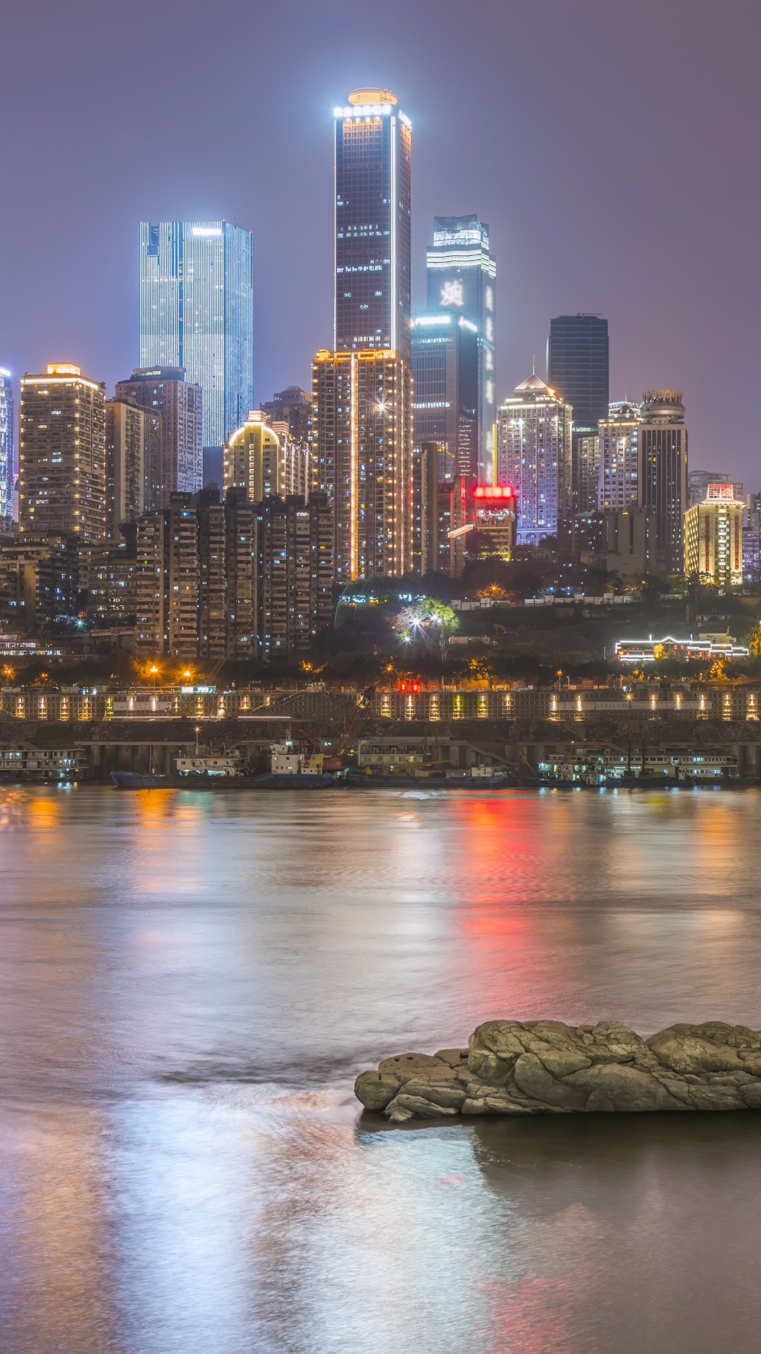 City Skyline Across Body of Water During Night Time. Wallpaper in 1080x1920 Resolution