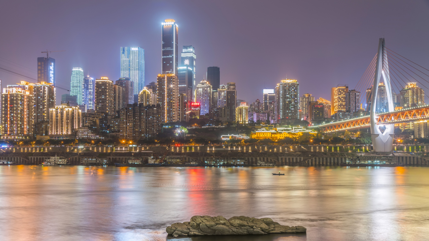 City Skyline Across Body of Water During Night Time. Wallpaper in 1366x768 Resolution