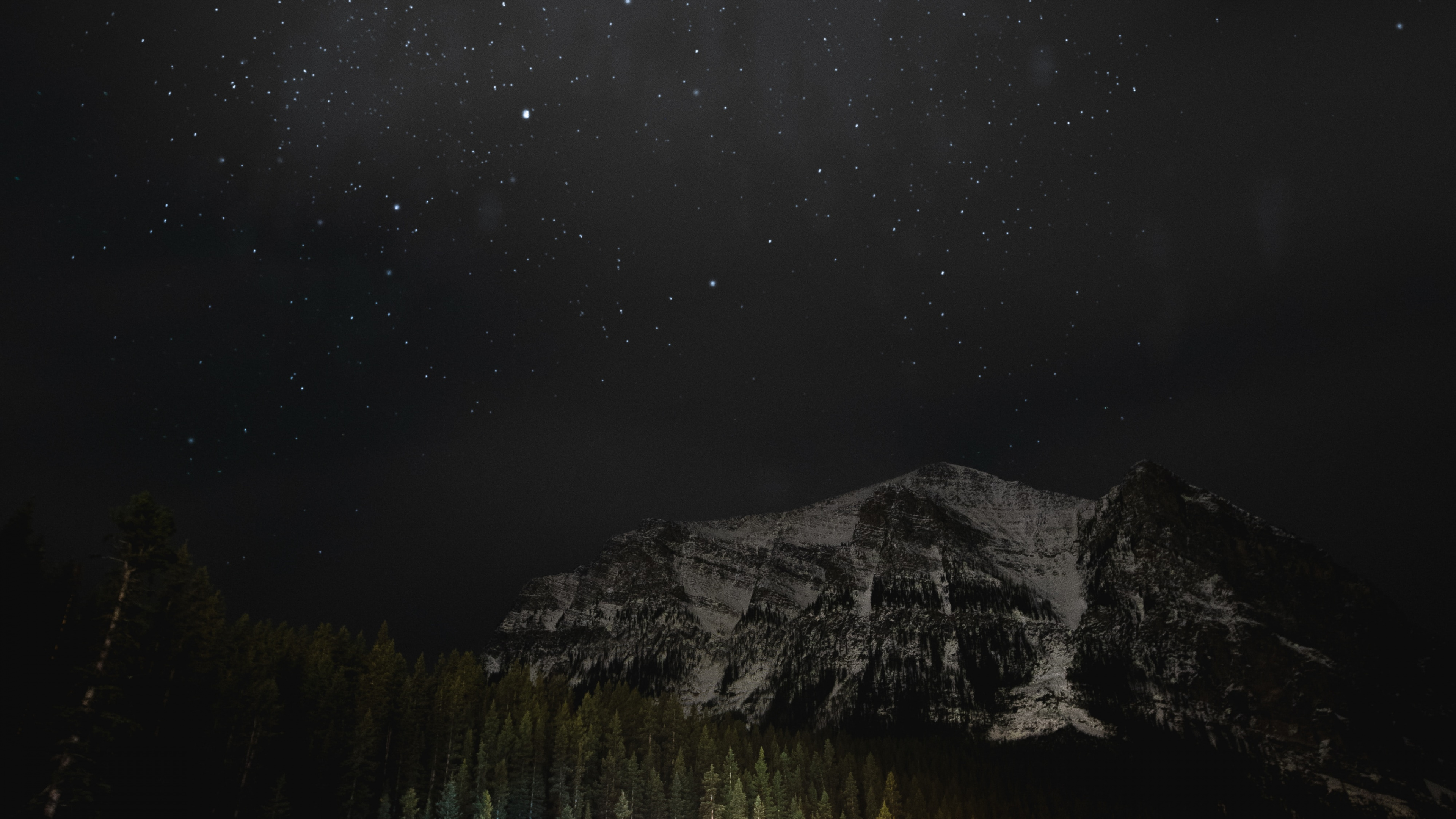 Person Standing on Water Near Mountain During Night Time. Wallpaper in 3840x2160 Resolution