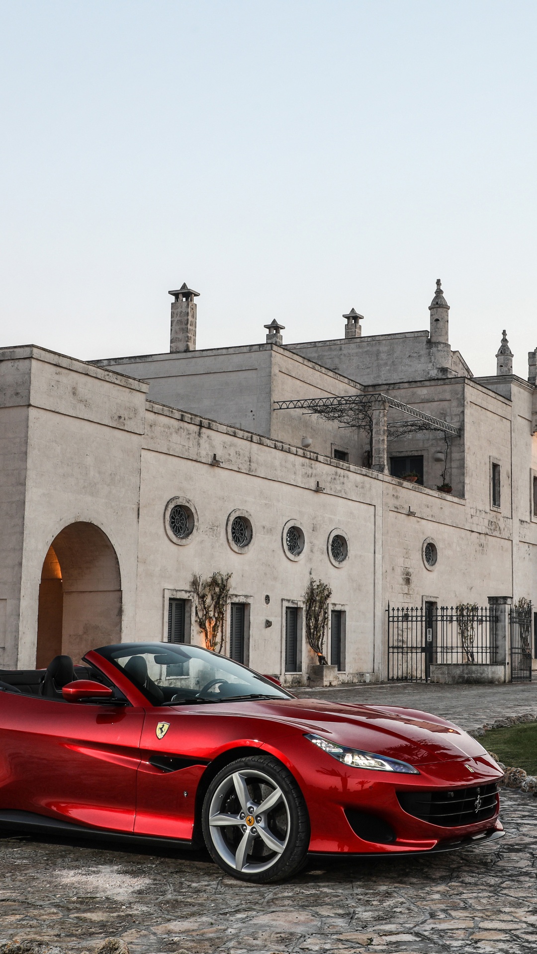 Red Ferrari 458 Italia Parked Near Brown Concrete Building During Daytime. Wallpaper in 1080x1920 Resolution