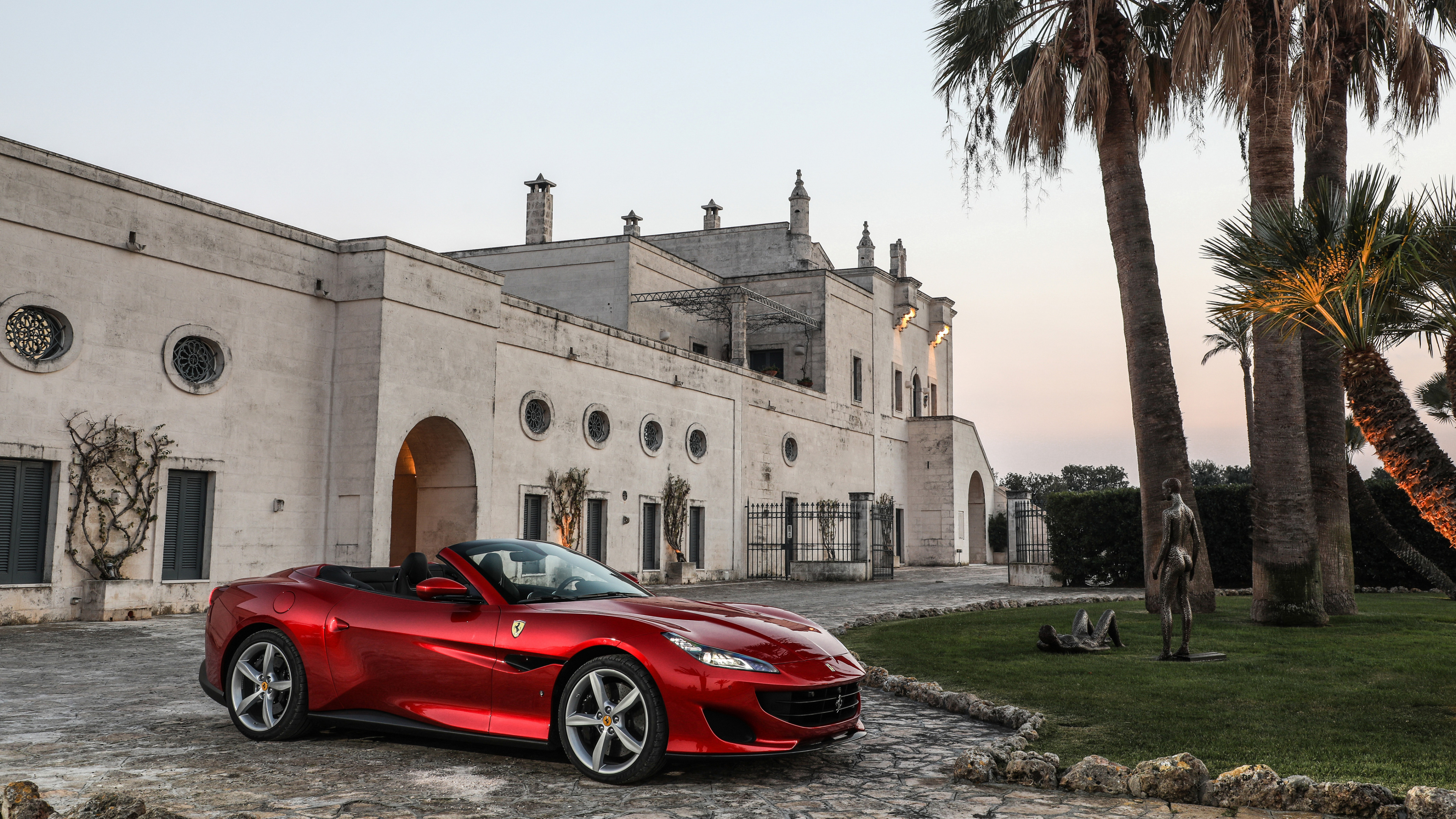 Red Ferrari 458 Italia Parked Near Brown Concrete Building During Daytime. Wallpaper in 3840x2160 Resolution