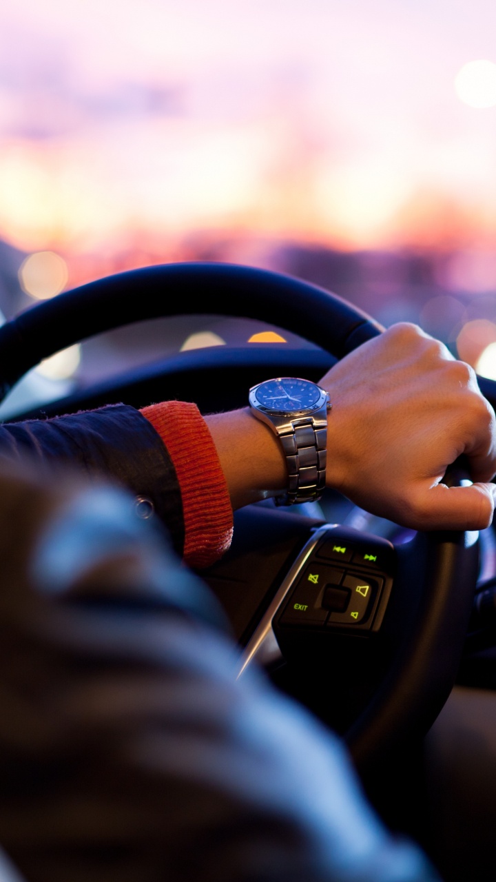 Person Driving Car During Daytime. Wallpaper in 720x1280 Resolution