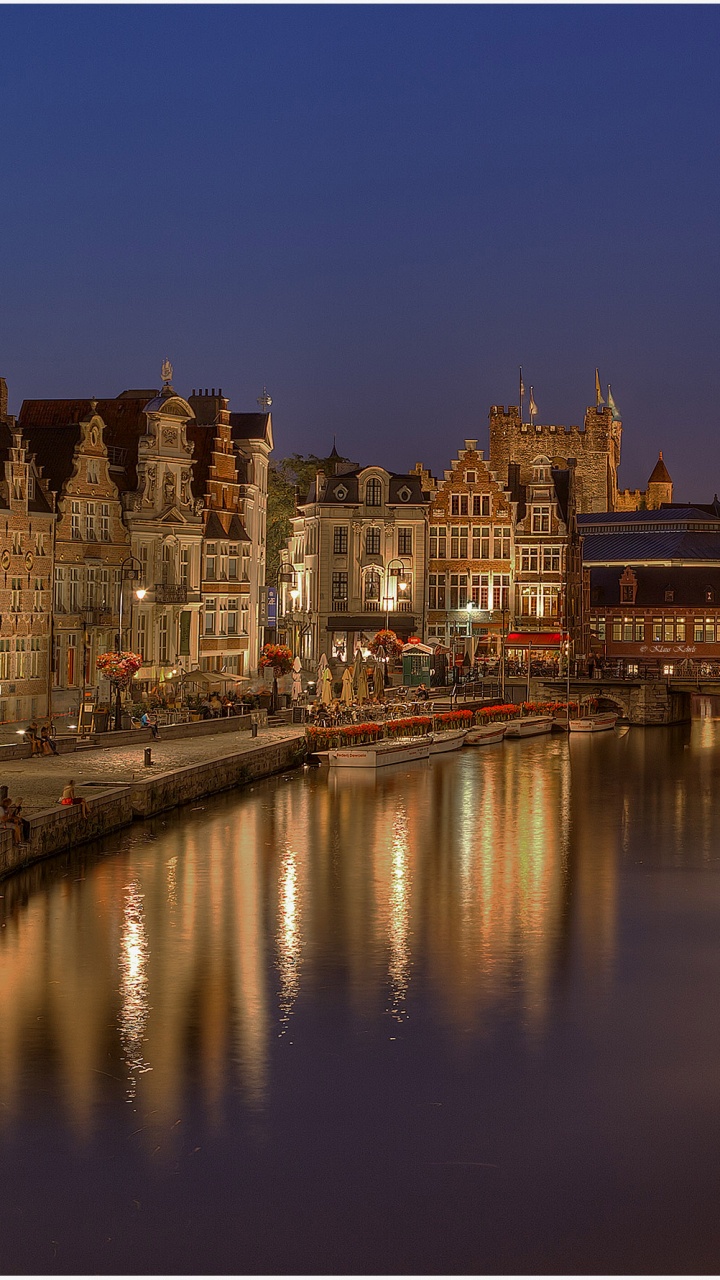 City Buildings Near Body of Water During Night Time. Wallpaper in 720x1280 Resolution