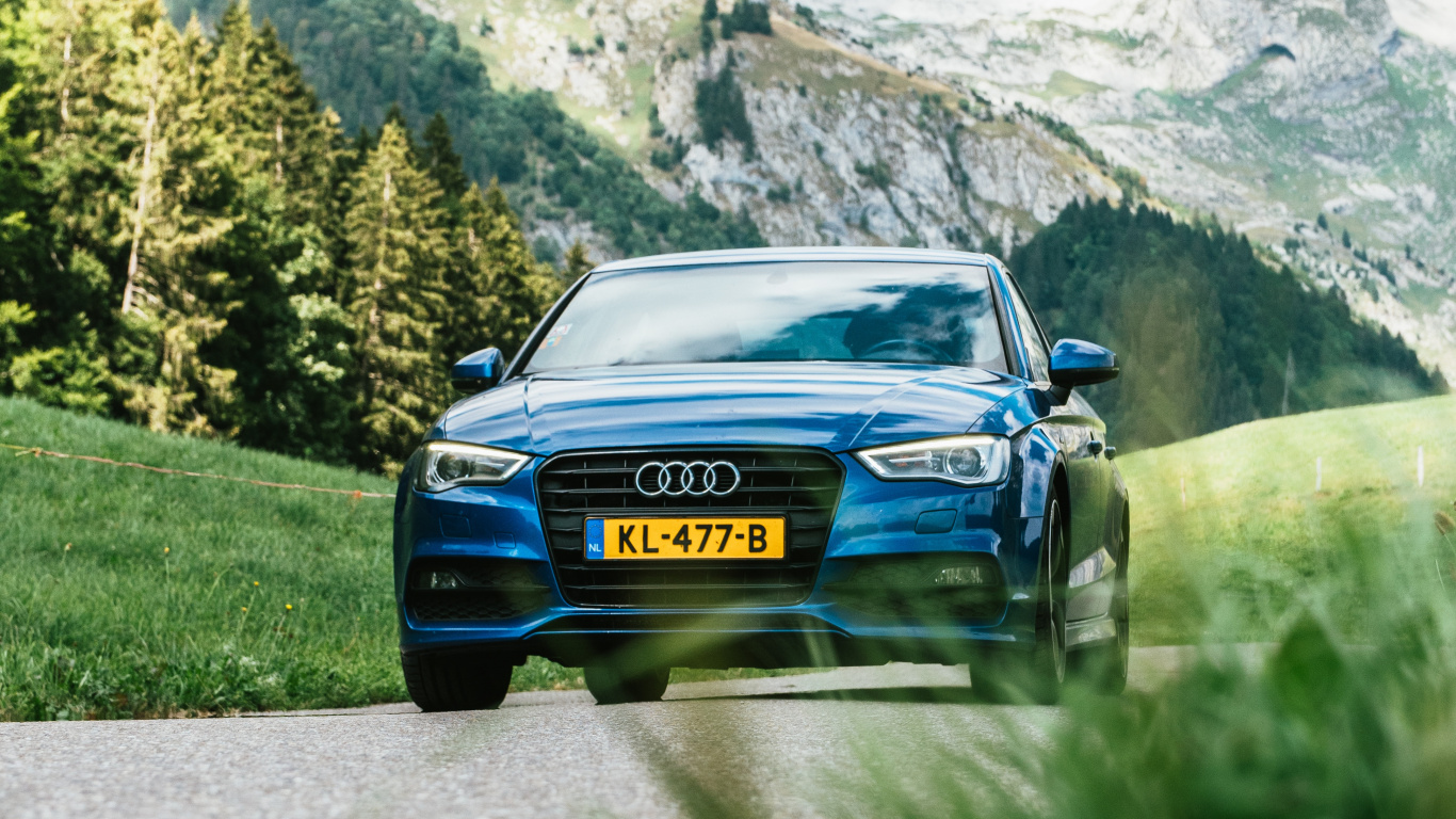 Blue Car on Road Near Green Grass Field and Trees During Daytime. Wallpaper in 1366x768 Resolution