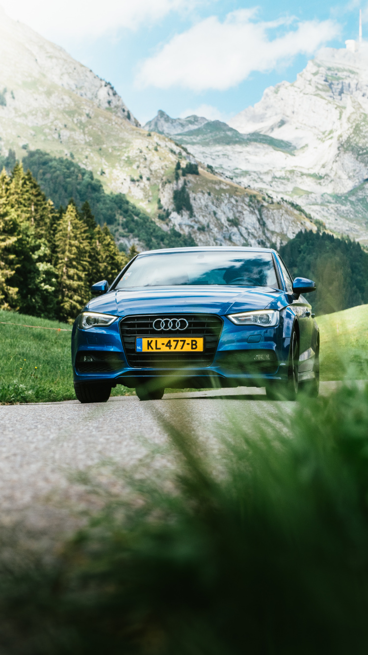 Blue Car on Road Near Green Grass Field and Trees During Daytime. Wallpaper in 750x1334 Resolution