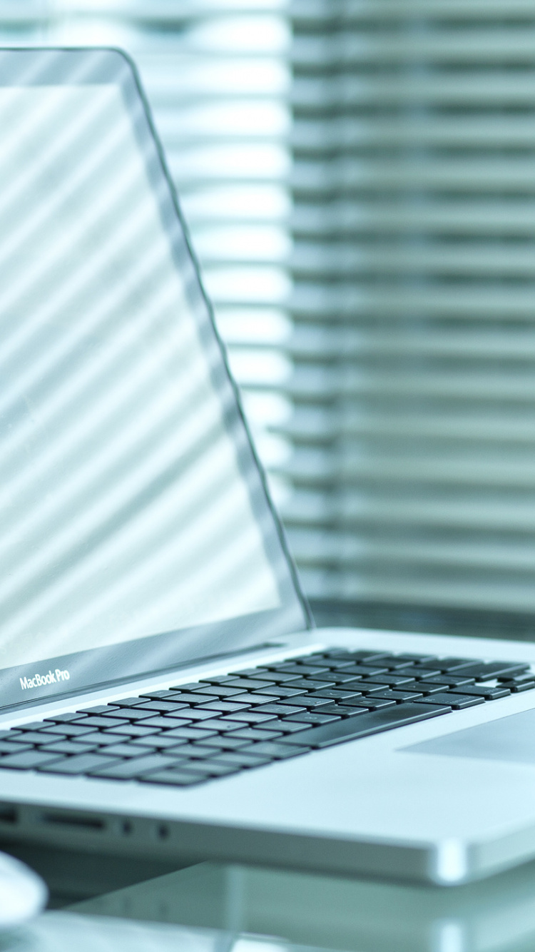 White Laptop Computer on White Table. Wallpaper in 750x1334 Resolution
