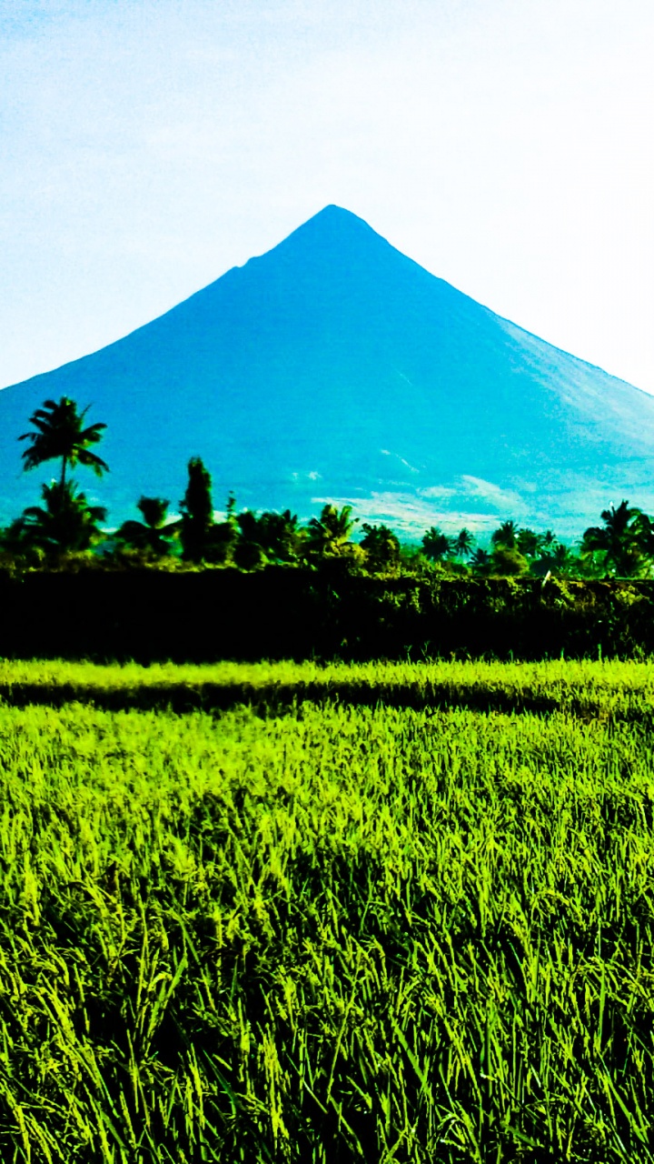 Green Grass Field Near Mountain Under White Clouds During Daytime. Wallpaper in 720x1280 Resolution