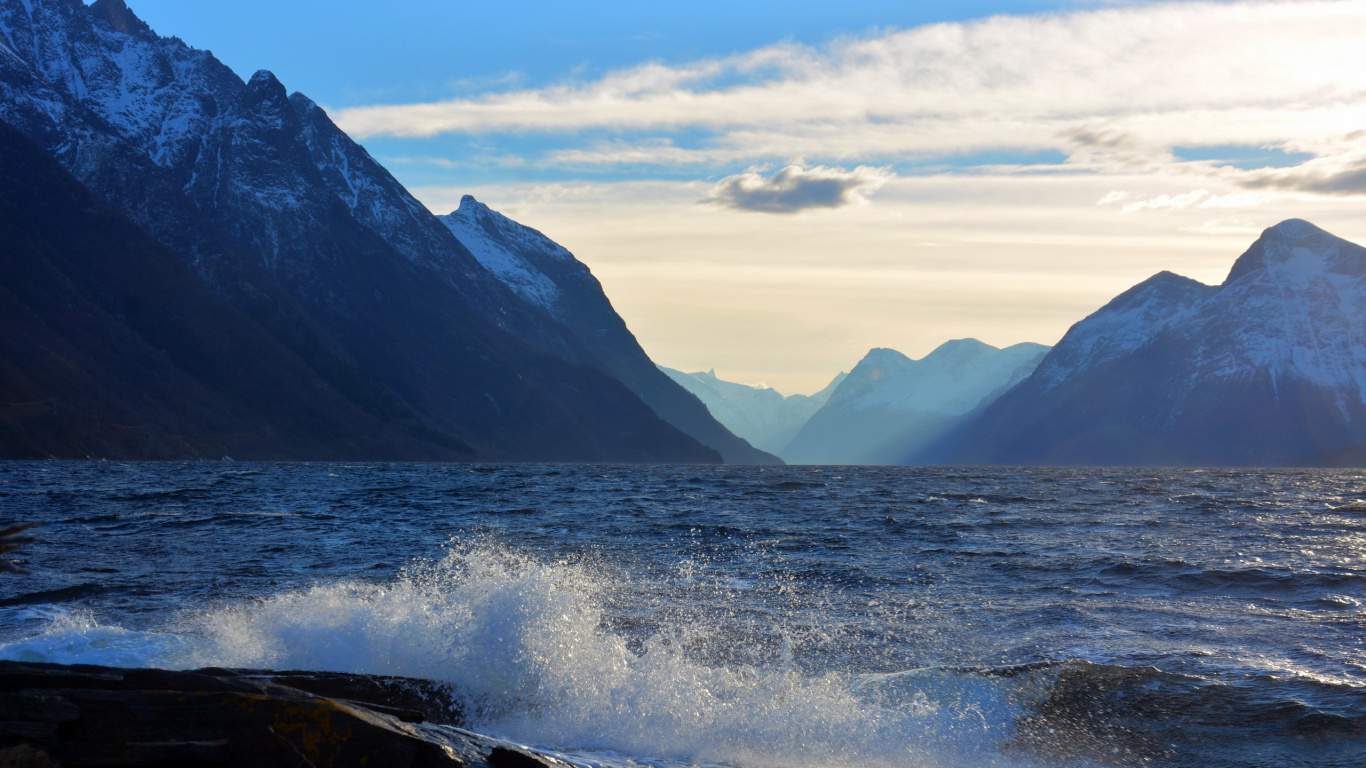 Body of Water Near Mountain Under Blue Sky During Daytime. Wallpaper in 1366x768 Resolution