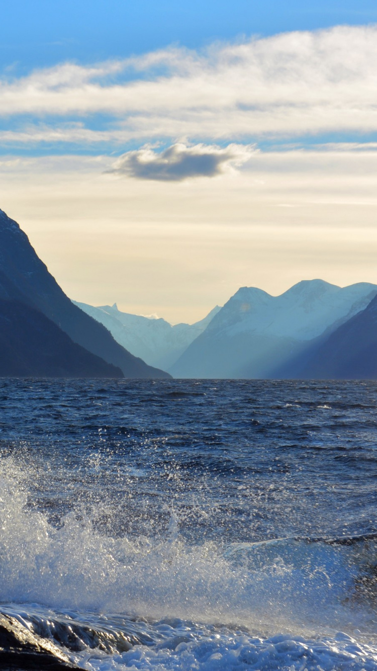 Body of Water Near Mountain Under Blue Sky During Daytime. Wallpaper in 750x1334 Resolution