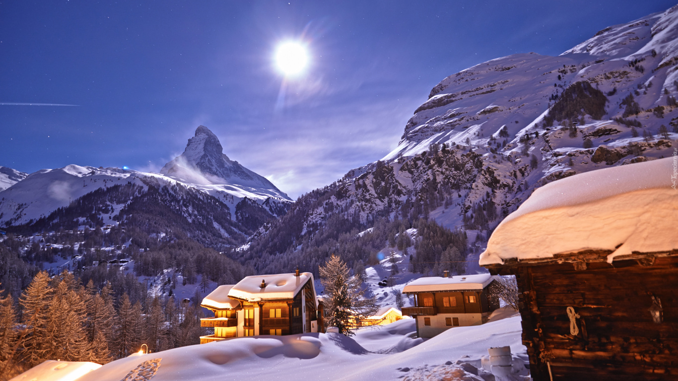 Brown House on Snow Covered Ground Near Snow Covered Mountain During Daytime. Wallpaper in 1366x768 Resolution