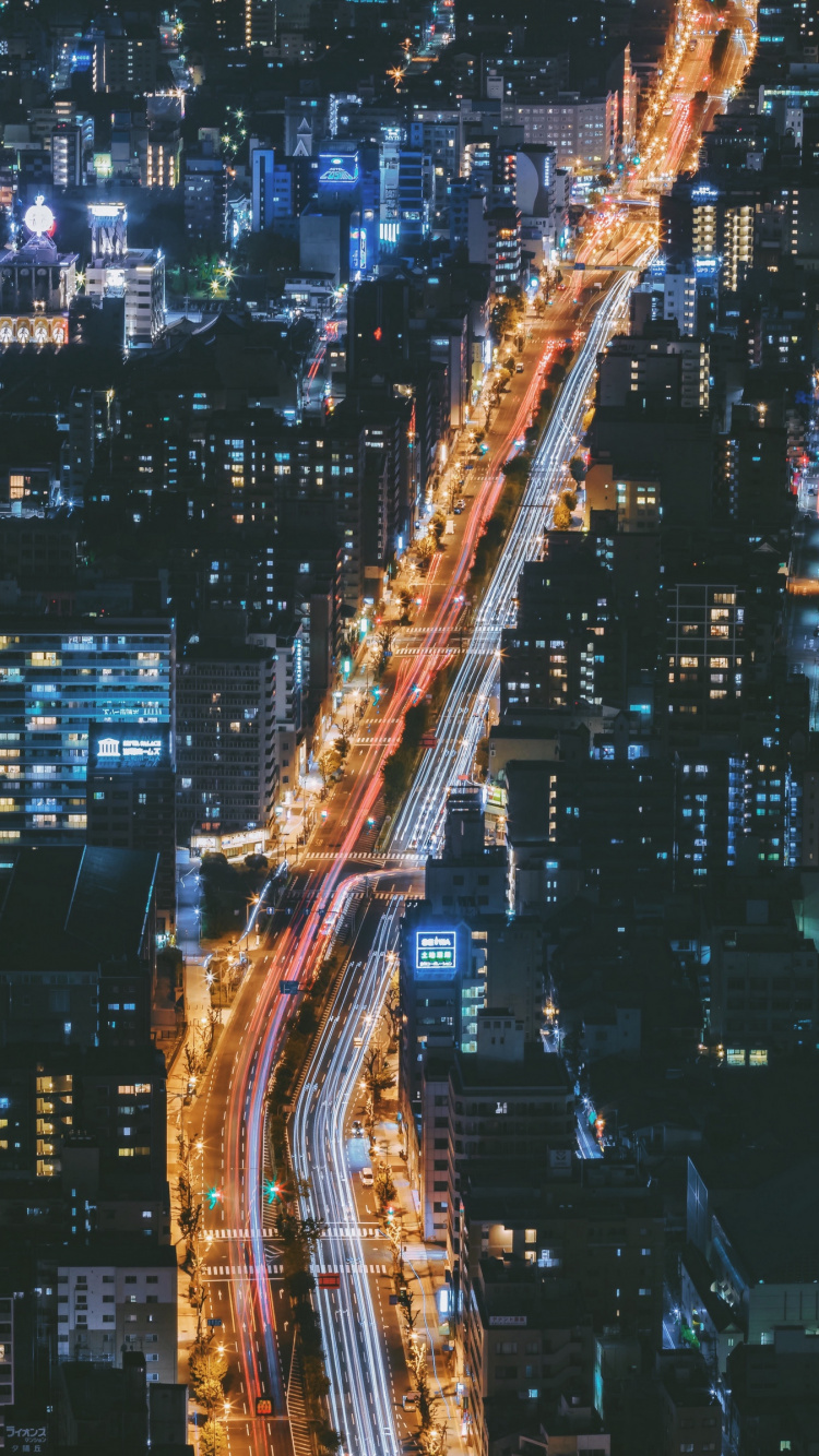 Vue Aérienne Des Bâtiments de la Ville Pendant la Nuit. Wallpaper in 750x1334 Resolution