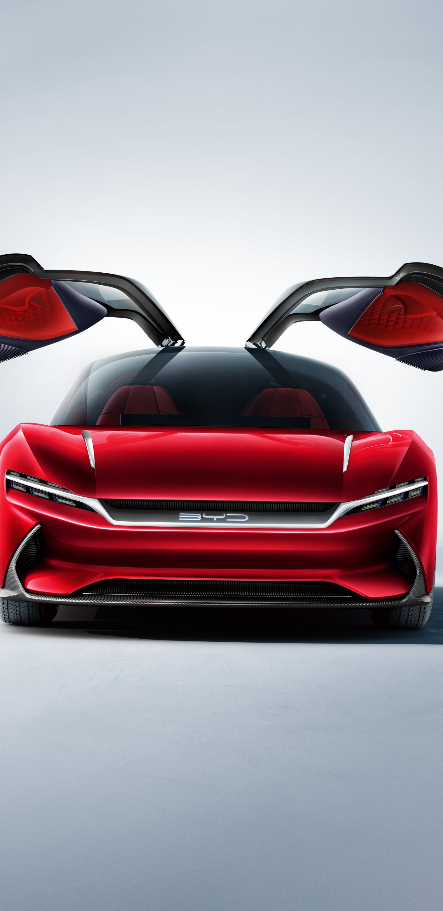 Coche Deportivo Ferrari Rojo Sobre Pavimento Gris. Wallpaper in 1440x2960 Resolution