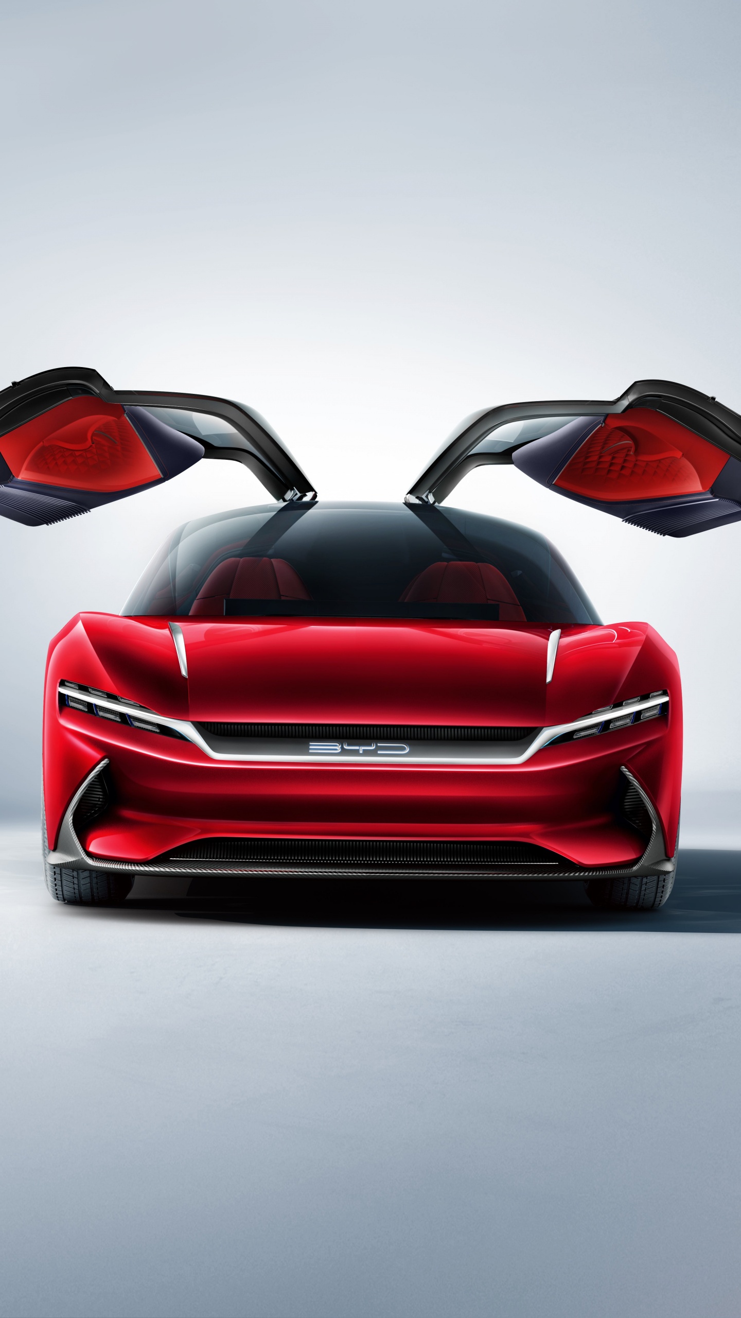 Roter Ferrari-sportwagen Auf Grauem Pflaster. Wallpaper in 1440x2560 Resolution