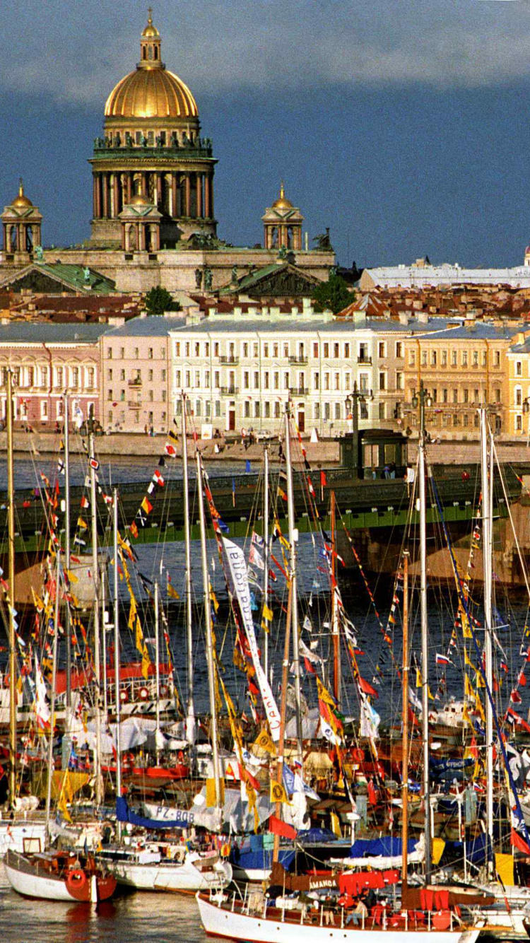 White and Brown Concrete Building Near Body of Water During Daytime. Wallpaper in 750x1334 Resolution