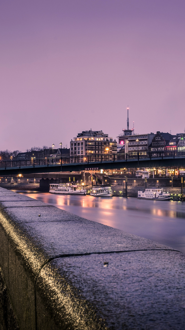 Body of Water Near City Buildings During Night Time. Wallpaper in 750x1334 Resolution