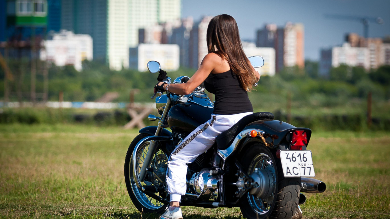 Woman in Blue Tank Top Riding on Black and White Motorcycle During Daytime. Wallpaper in 1280x720 Resolution