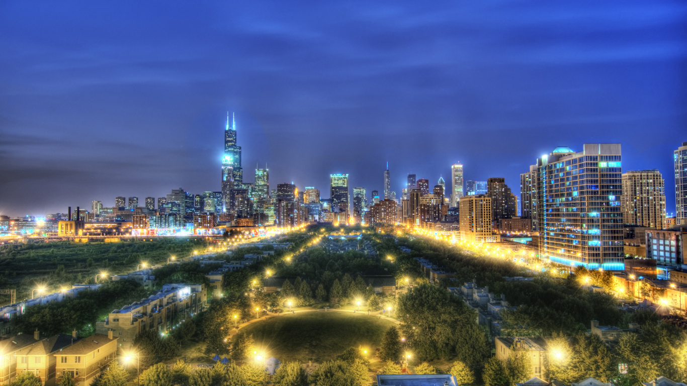 Green Trees and City Lights During Night Time. Wallpaper in 1366x768 Resolution