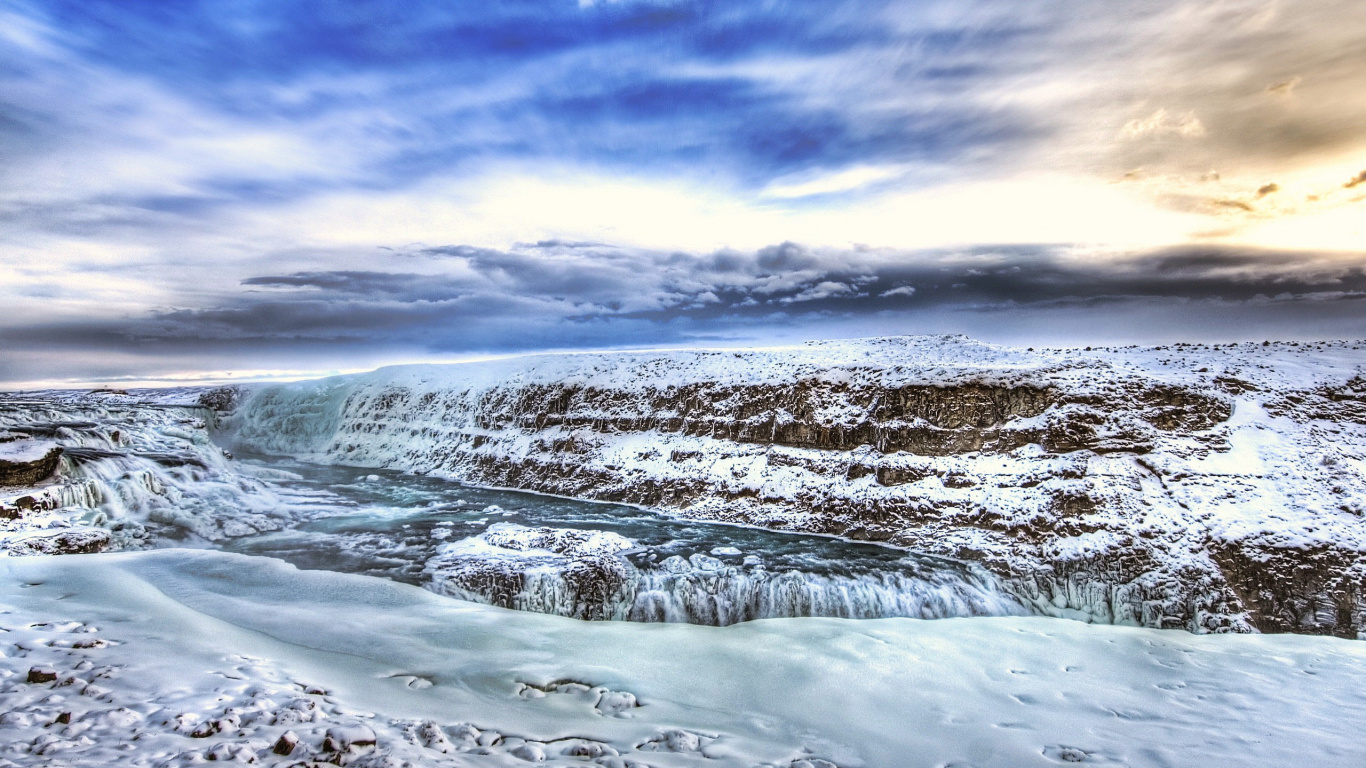 Snow Covered Field Under Cloudy Sky During Daytime. Wallpaper in 1366x768 Resolution