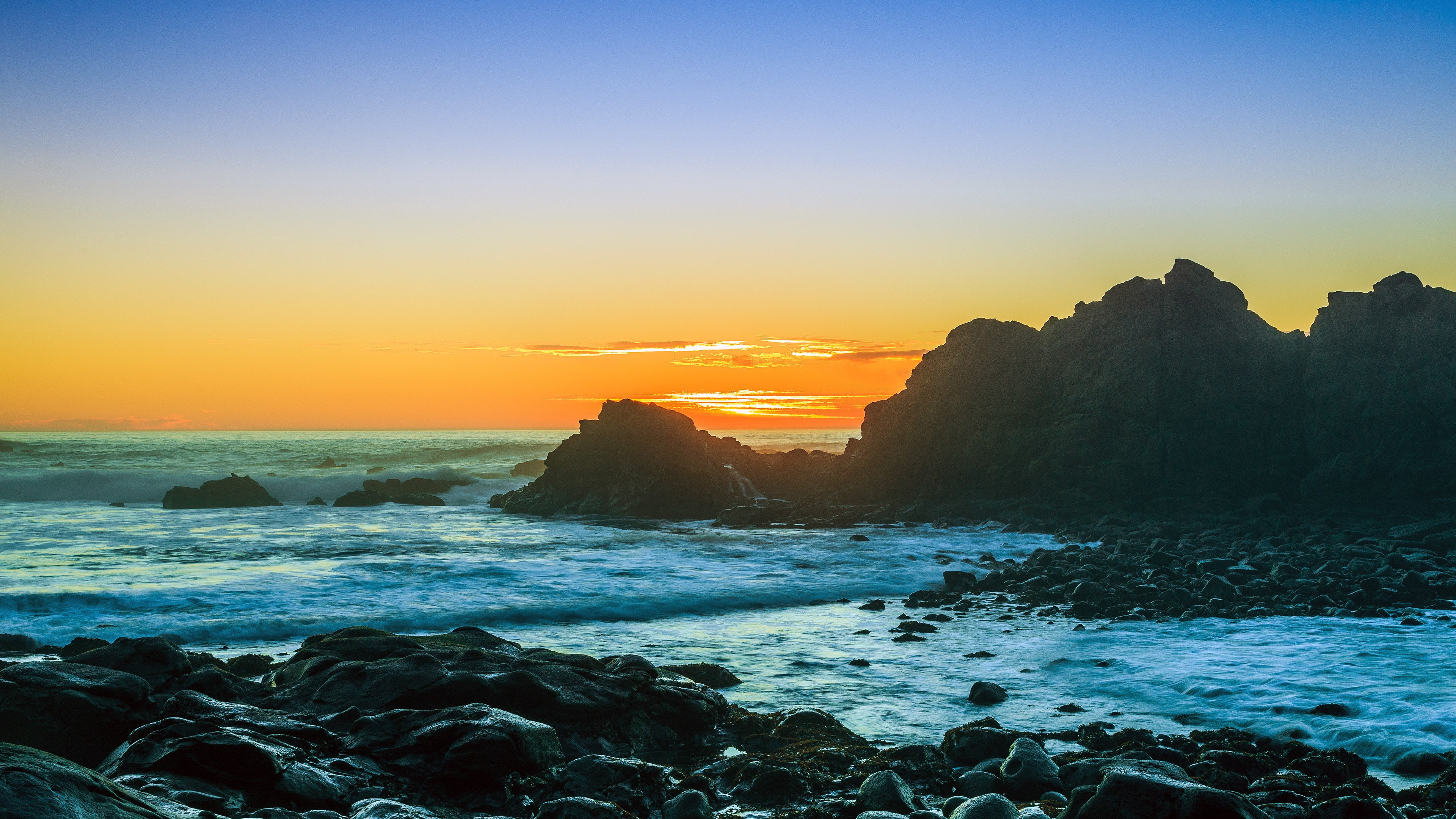 Ocean Waves Crashing on Rocks During Sunset. Wallpaper in 3840x2160 Resolution
