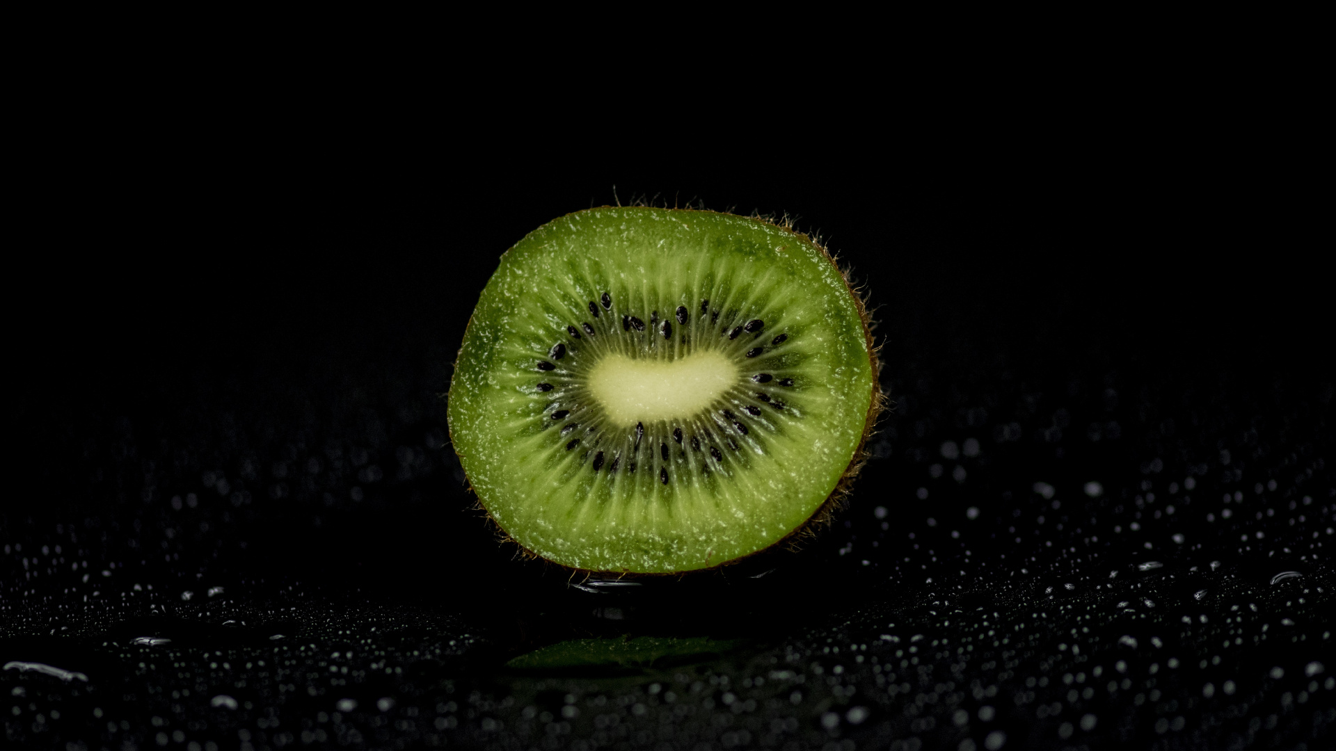 Green Round Fruit on Black Surface. Wallpaper in 1920x1080 Resolution