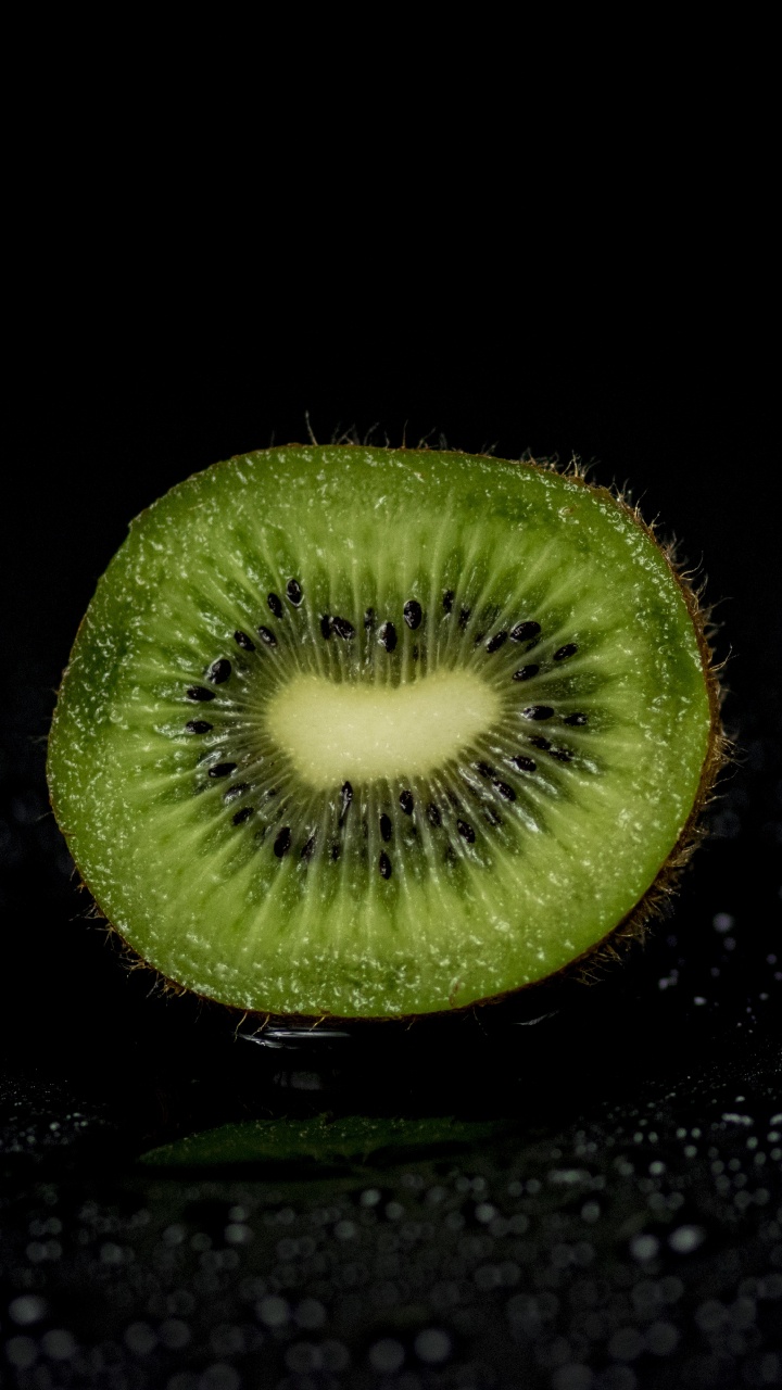 Green Round Fruit on Black Surface. Wallpaper in 720x1280 Resolution