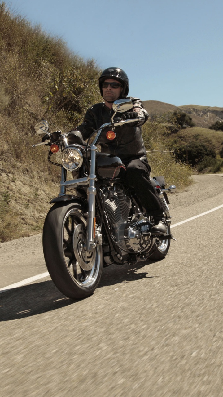 Man in Black Jacket Riding Motorcycle on Road During Daytime. Wallpaper in 720x1280 Resolution