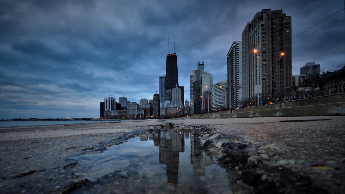 City Skyline Across The Sea During Daytime. Wallpaper in 1366x768 Resolution