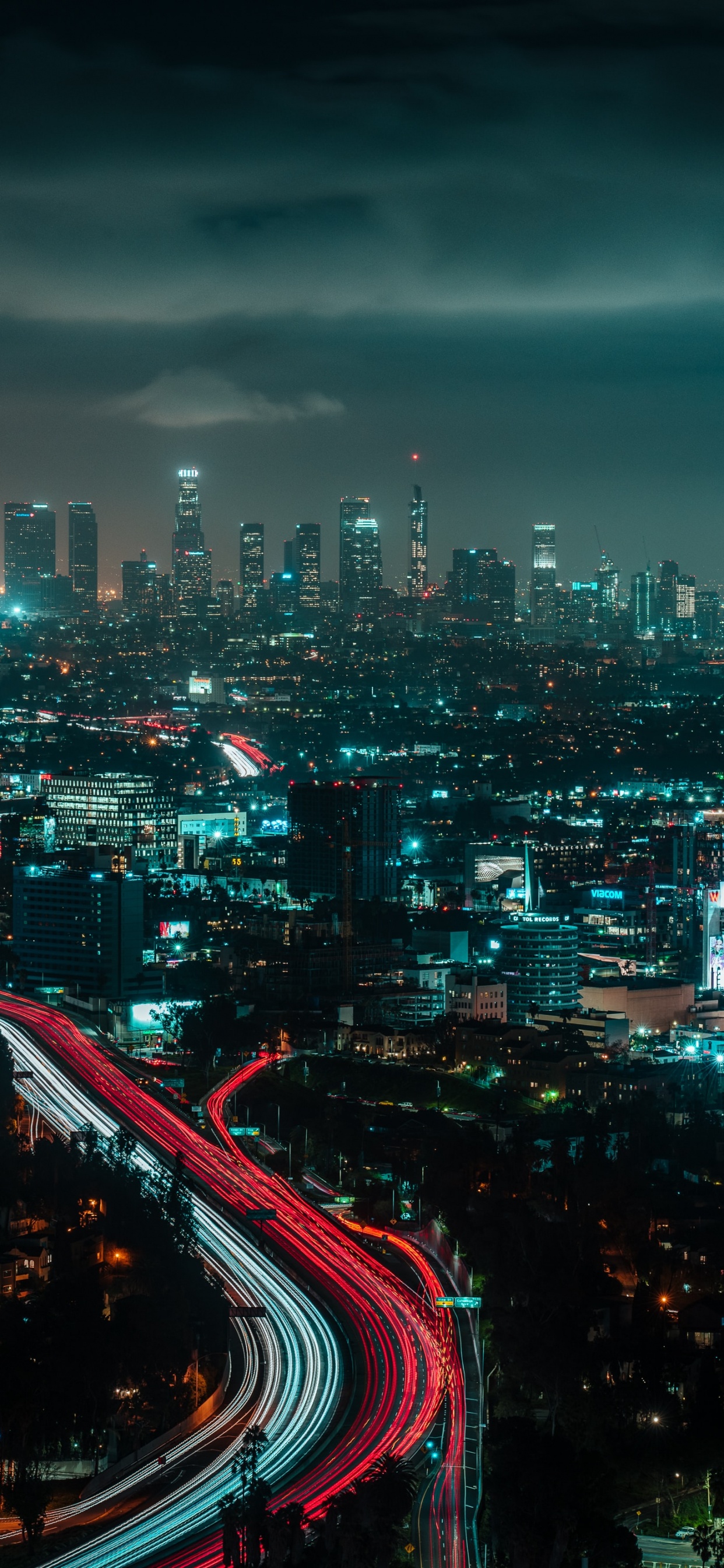 City Skyline During Night Time. Wallpaper in 1242x2688 Resolution