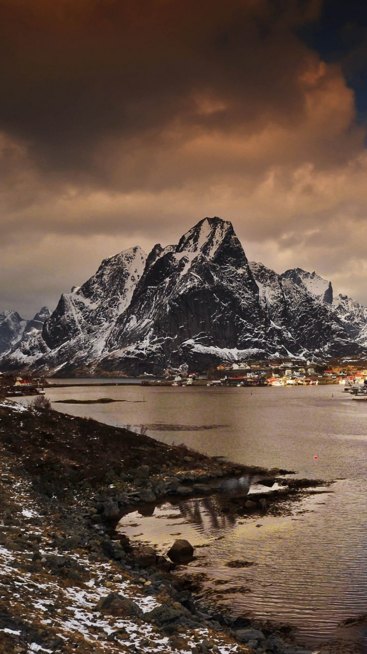 White and Black Mountains Near Body of Water During Daytime. Wallpaper in 750x1334 Resolution
