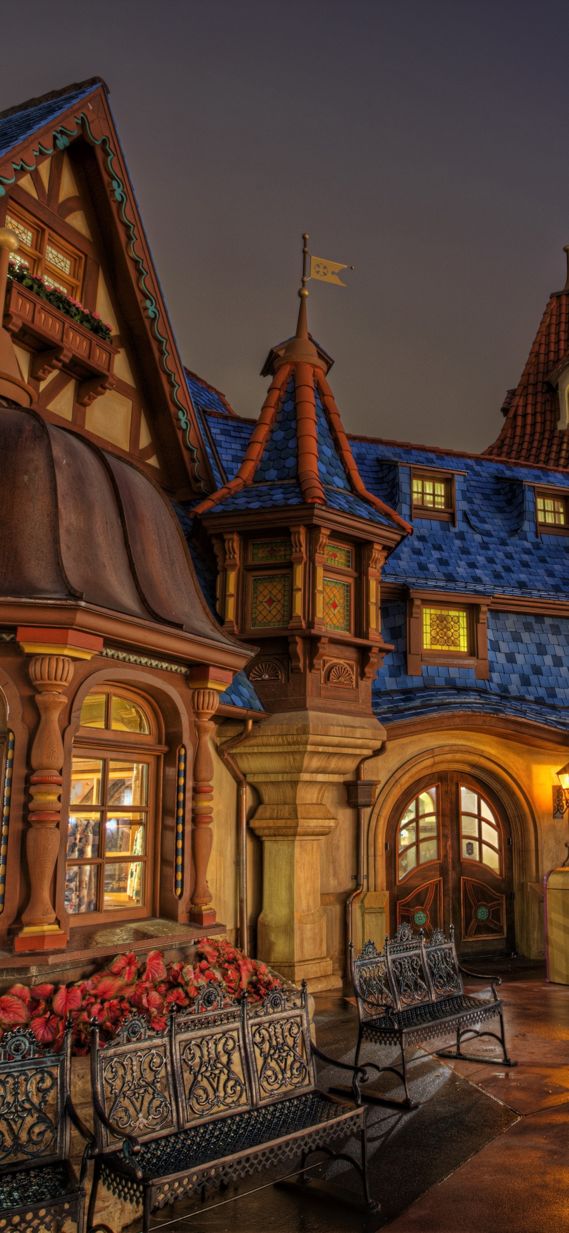 Braunes Und Weißes Betongebäude Während Der Nacht. Wallpaper in 1125x2436 Resolution