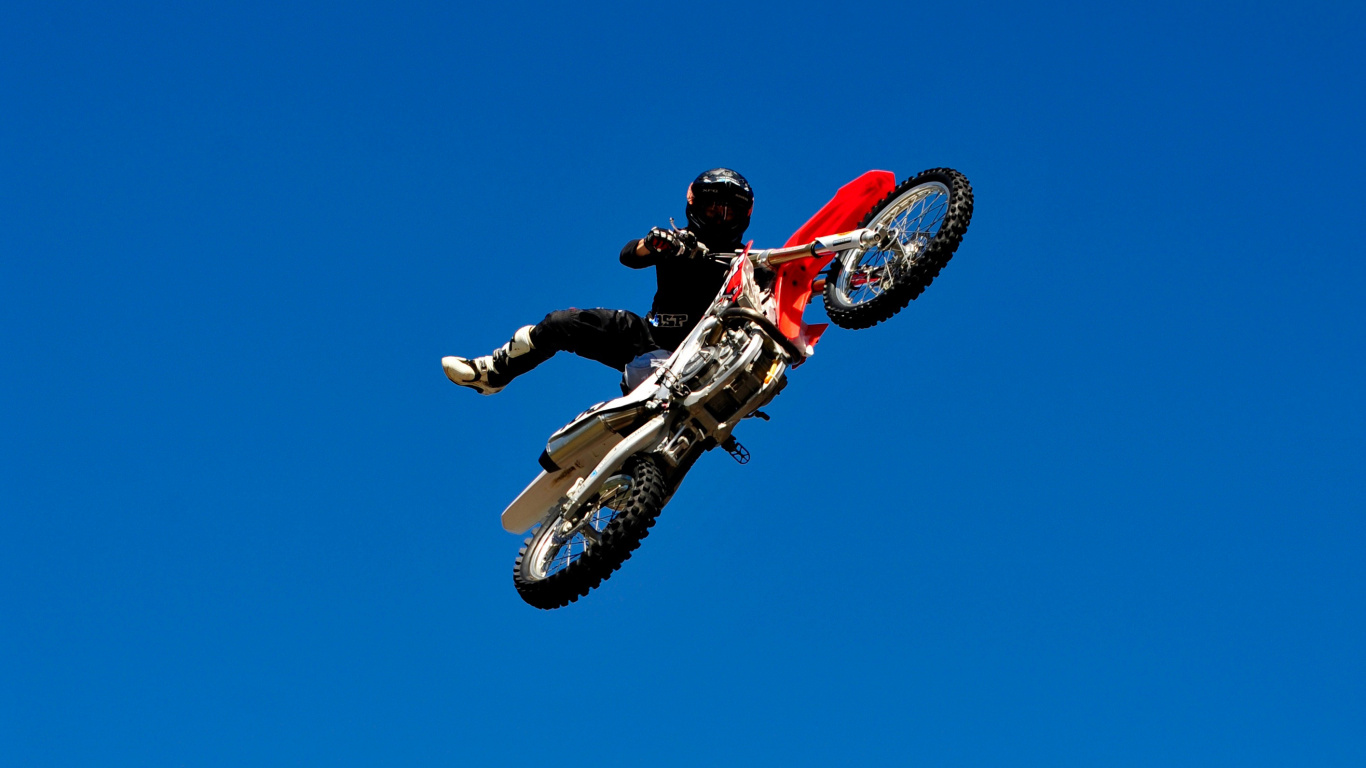 Man in Red and Black Motocross Suit Riding Red and White Motocross Dirt Bike. Wallpaper in 1366x768 Resolution