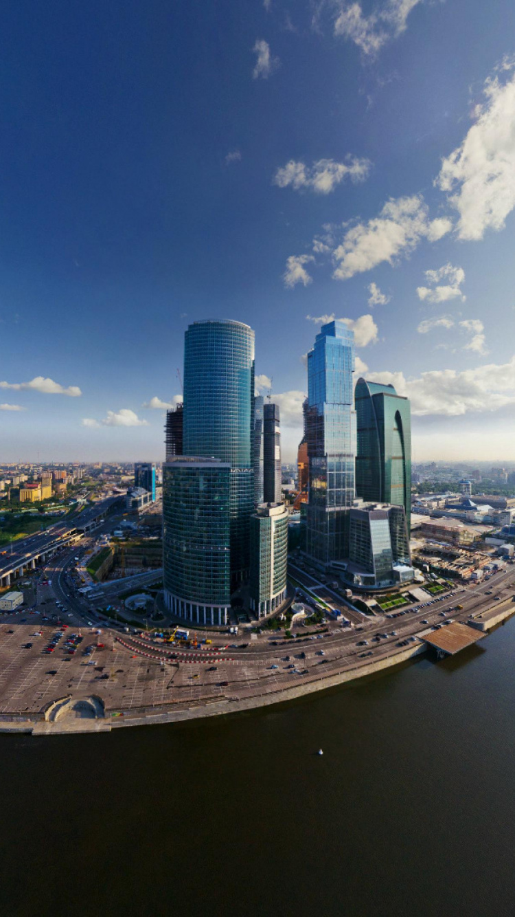 City Skyline Under Blue Sky and White Clouds During Daytime. Wallpaper in 750x1334 Resolution