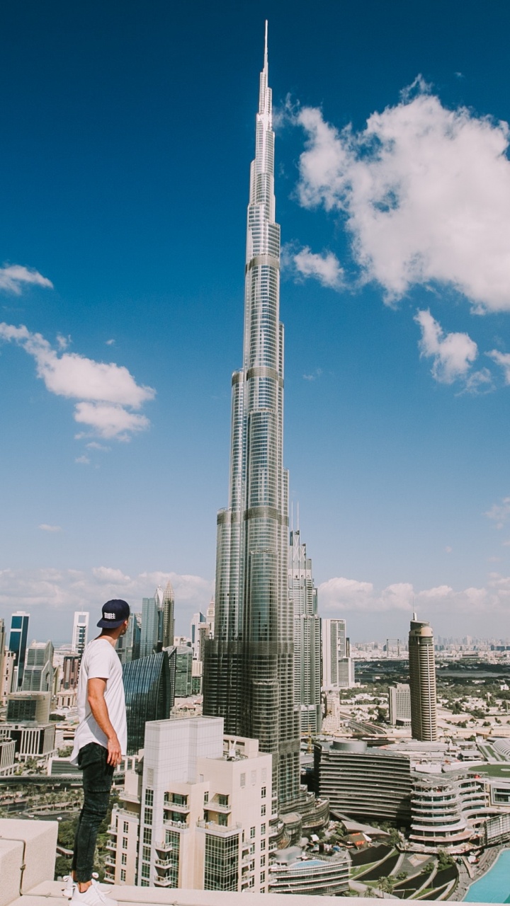 People Walking on Street Near High Rise Buildings During Daytime. Wallpaper in 720x1280 Resolution