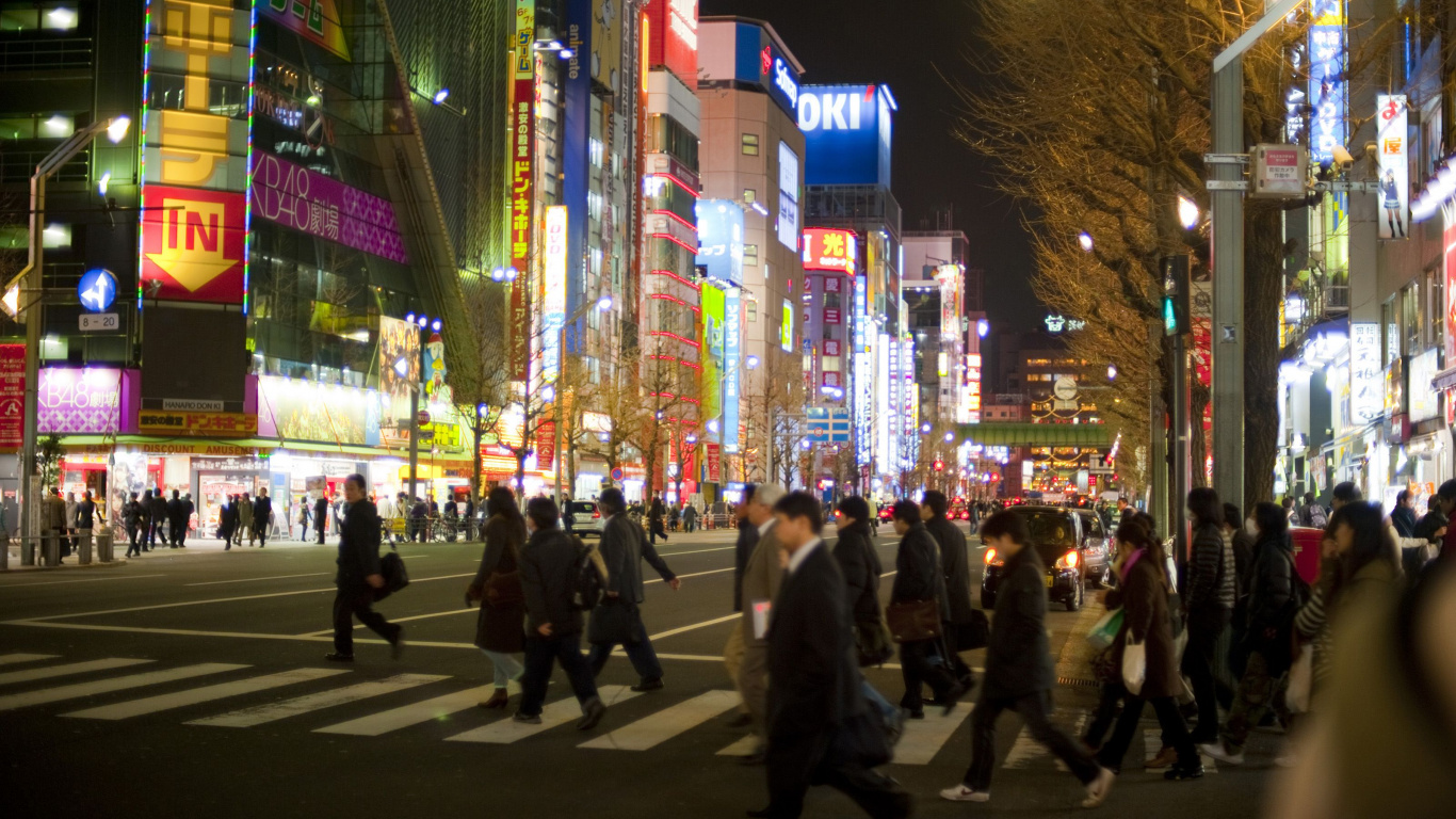 People Walking on Street During Night Time. Wallpaper in 1366x768 Resolution