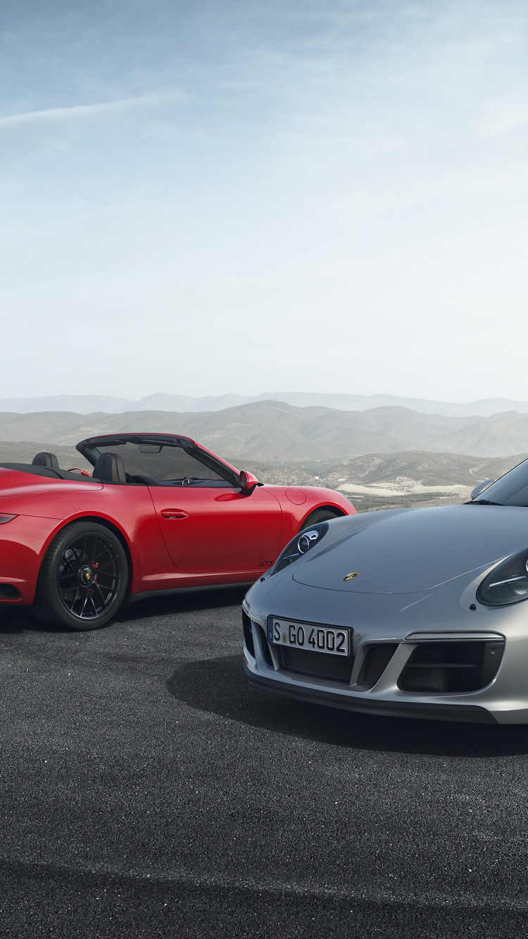 Red Ferrari Sports Car on Road During Daytime. Wallpaper in 750x1334 Resolution