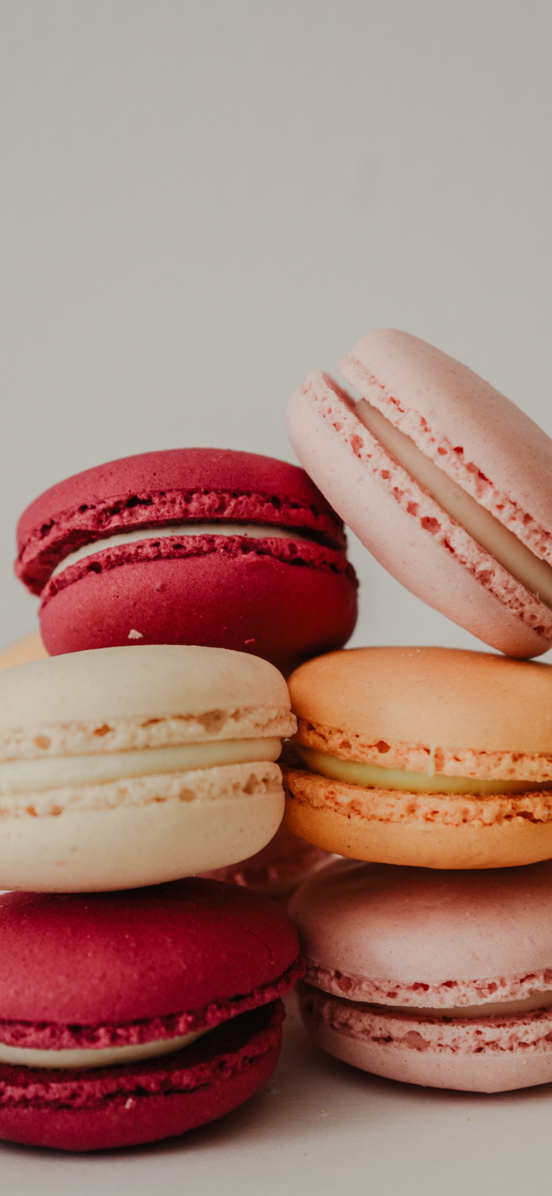 3 Pink and White Macaroons. Wallpaper in 1125x2436 Resolution