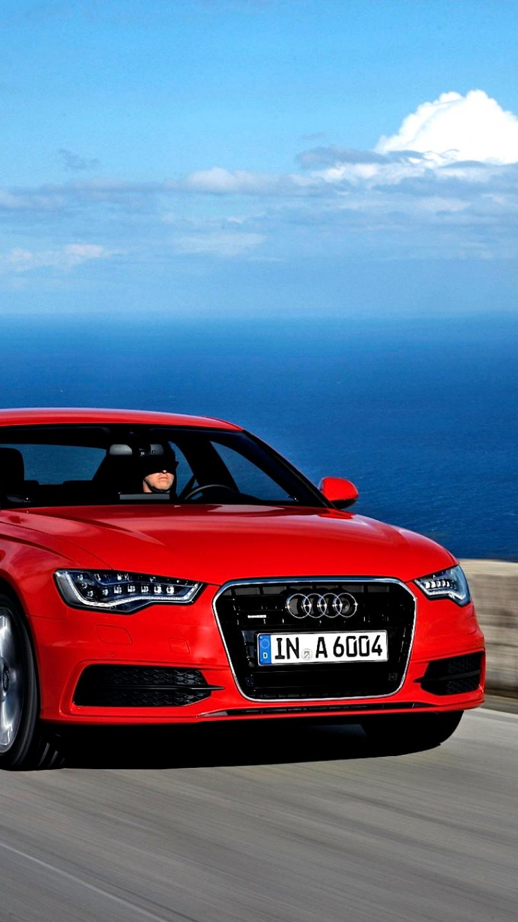 Red Audi r 8 on Road During Daytime. Wallpaper in 750x1334 Resolution