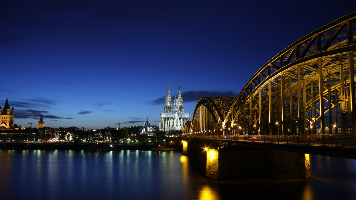 Lighted Bridge Over Water During Night Time. Wallpaper in 1366x768 Resolution