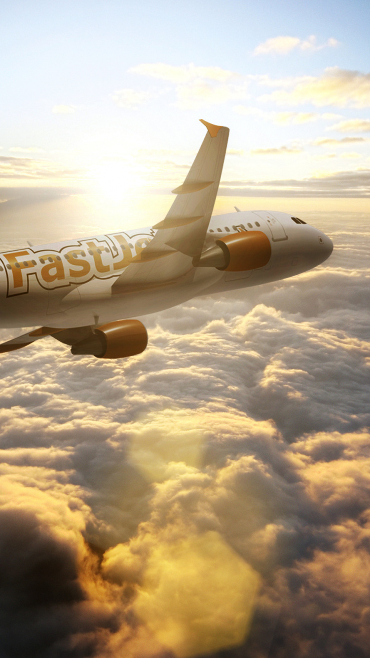 White and Blue Airplane Flying Over White Clouds During Daytime. Wallpaper in 750x1334 Resolution