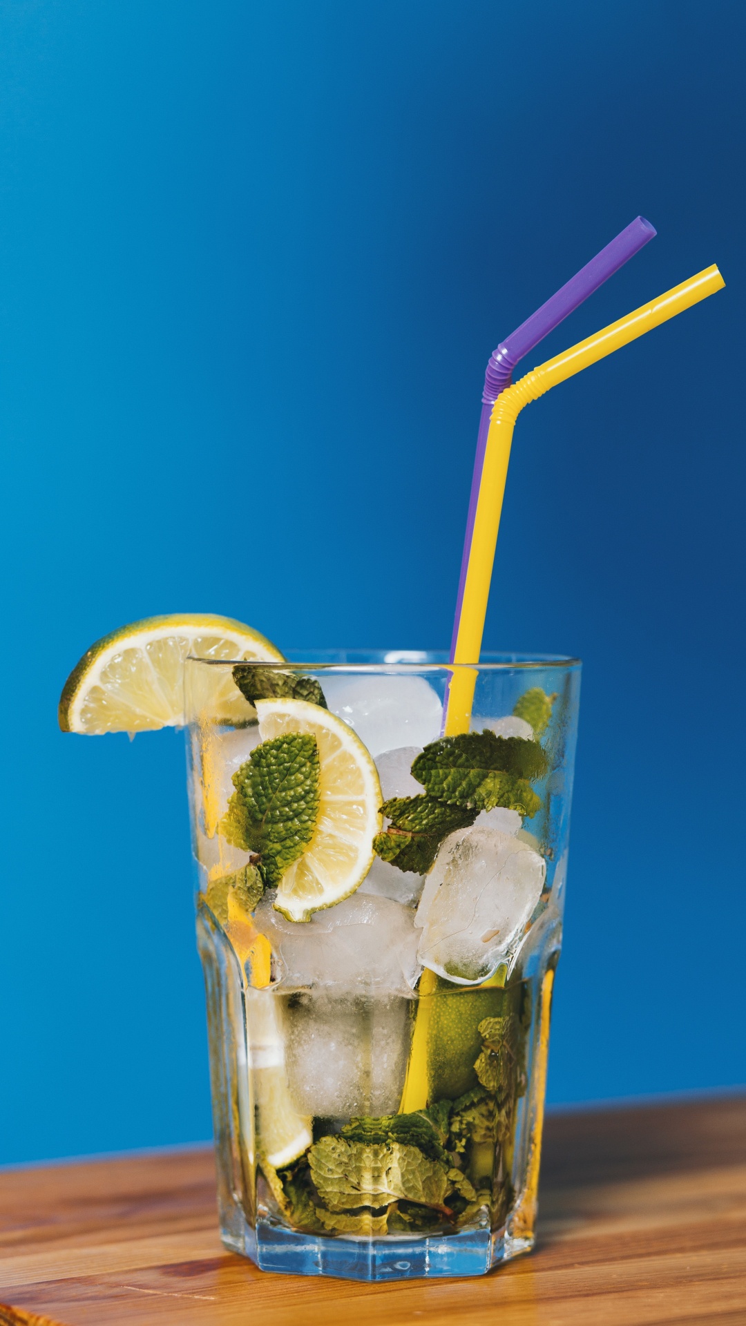 Clear Drinking Glass With Ice and Straw. Wallpaper in 1080x1920 Resolution