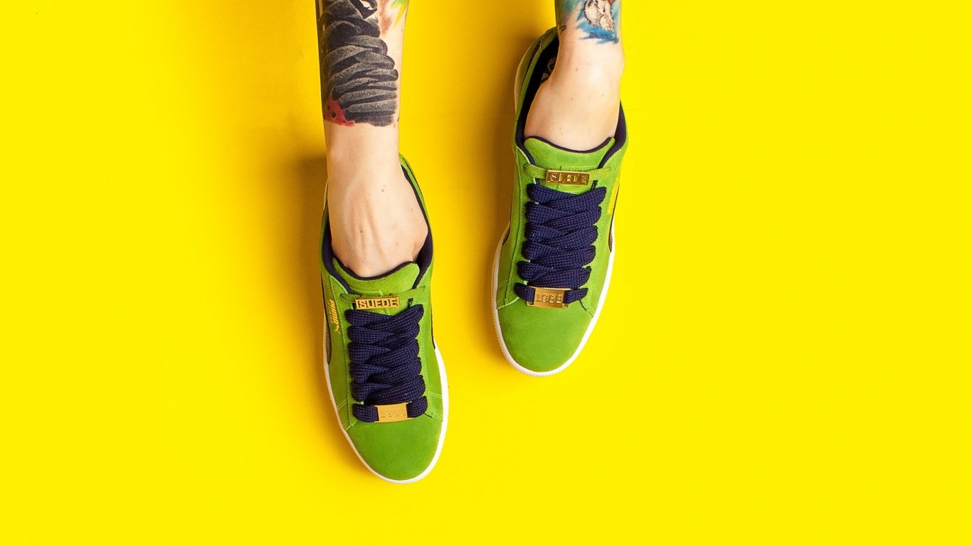 Person in Blue Denim Jeans and Black and White Sneakers. Wallpaper in 1366x768 Resolution