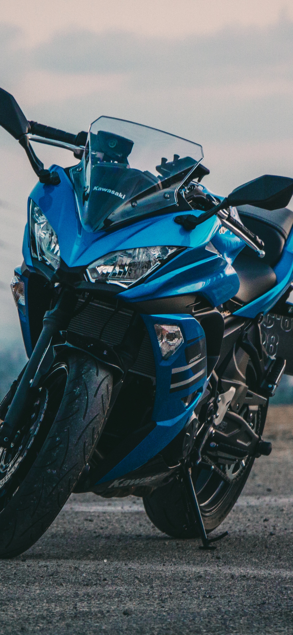 Blue and Black Sports Bike on Gray Asphalt Road During Daytime. Wallpaper in 1242x2688 Resolution