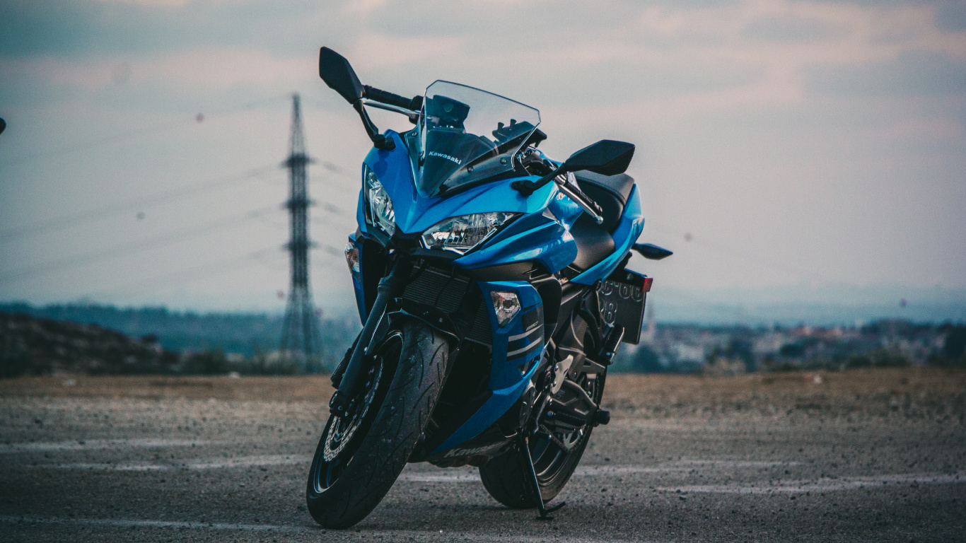 Blue and Black Sports Bike on Gray Asphalt Road During Daytime. Wallpaper in 1366x768 Resolution