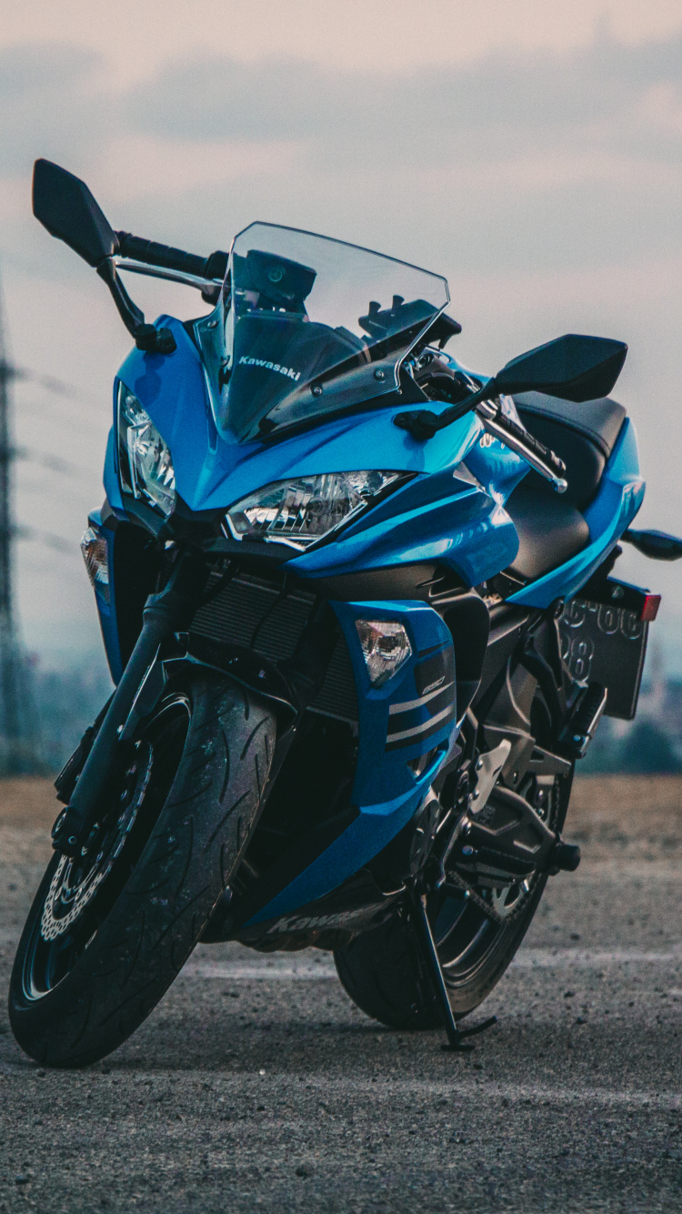 Blue and Black Sports Bike on Gray Asphalt Road During Daytime. Wallpaper in 750x1334 Resolution