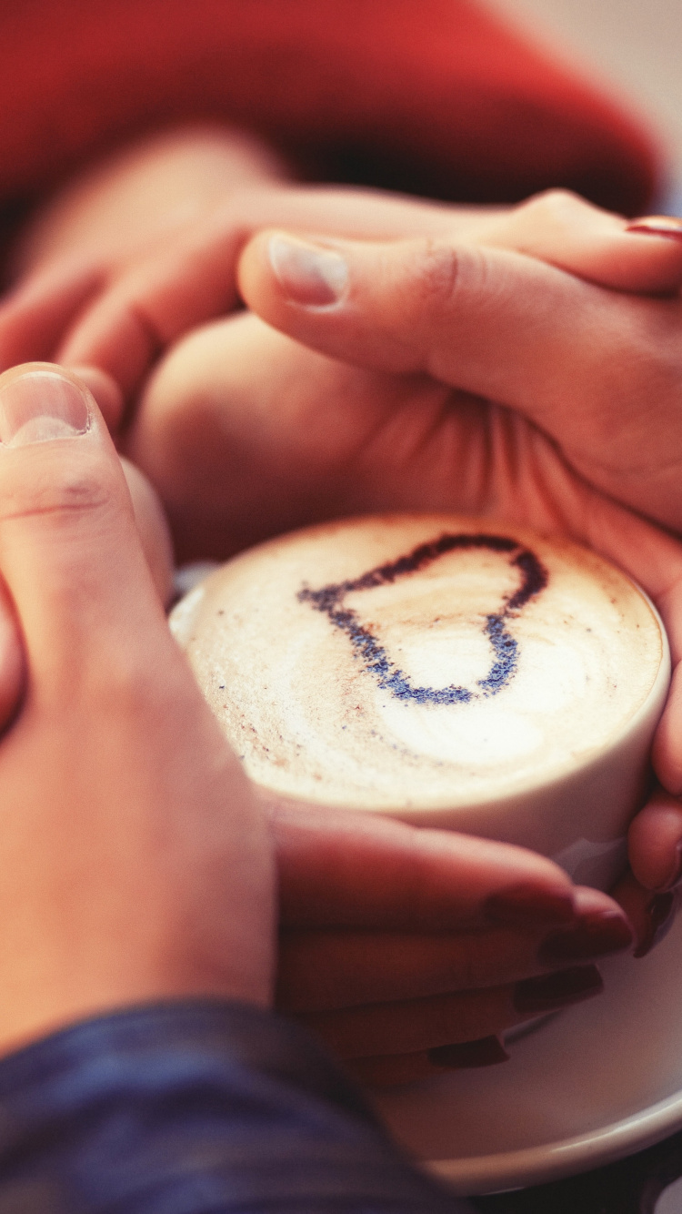 Person Holding White and Brown Round Ornament. Wallpaper in 750x1334 Resolution