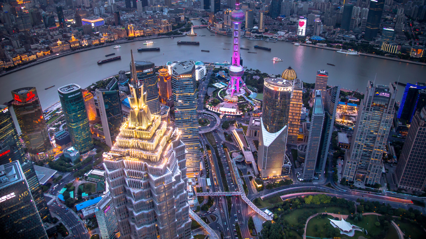 Aerial View of City Buildings During Night Time. Wallpaper in 1366x768 Resolution