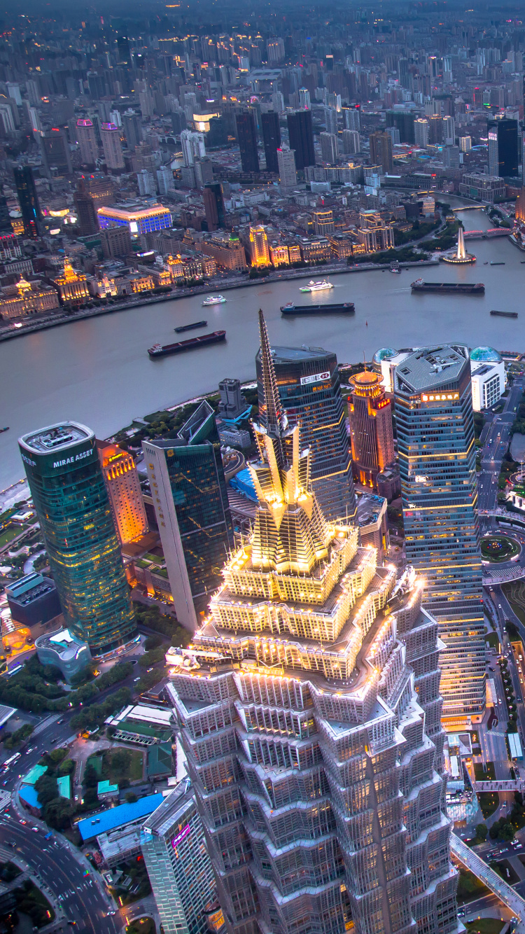 Aerial View of City Buildings During Night Time. Wallpaper in 750x1334 Resolution