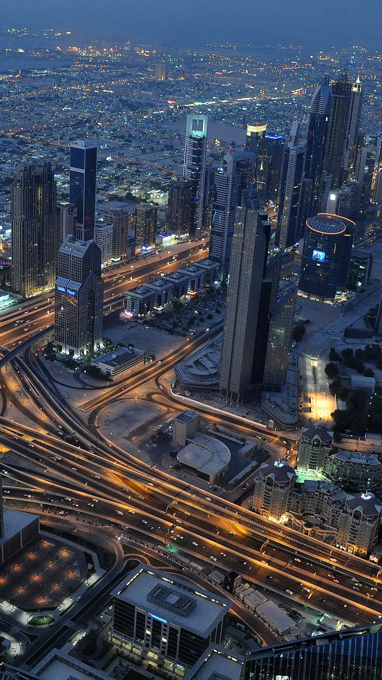 Aerial View of City Buildings During Night Time. Wallpaper in 750x1334 Resolution