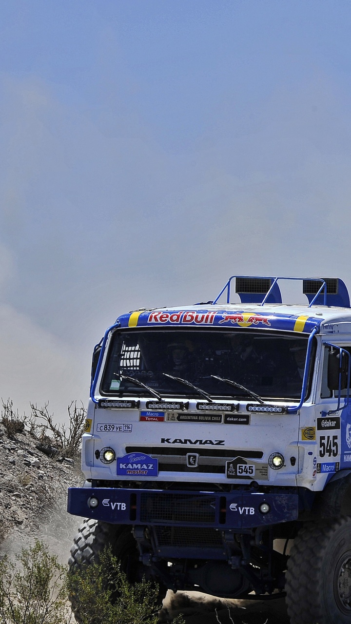 Blue and White Truck on Green Grass Field Under White Clouds and Blue Sky During Daytime. Wallpaper in 720x1280 Resolution